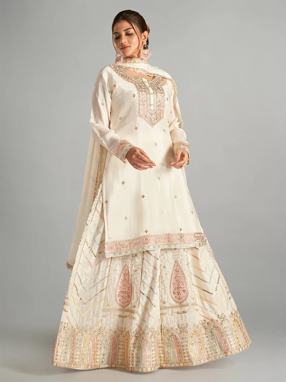 Trendy cream chiffon lehenga suit