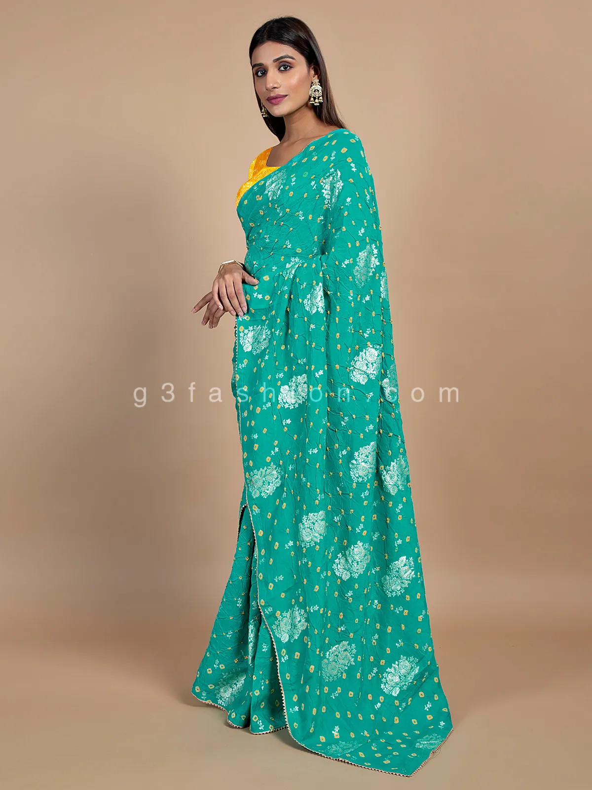 Turquoise green wedding wear bandhej saree