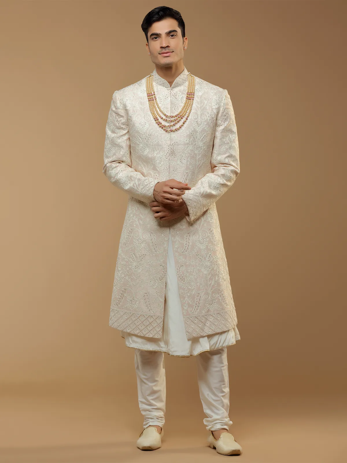 Wedding wear peach hued silk sherwani