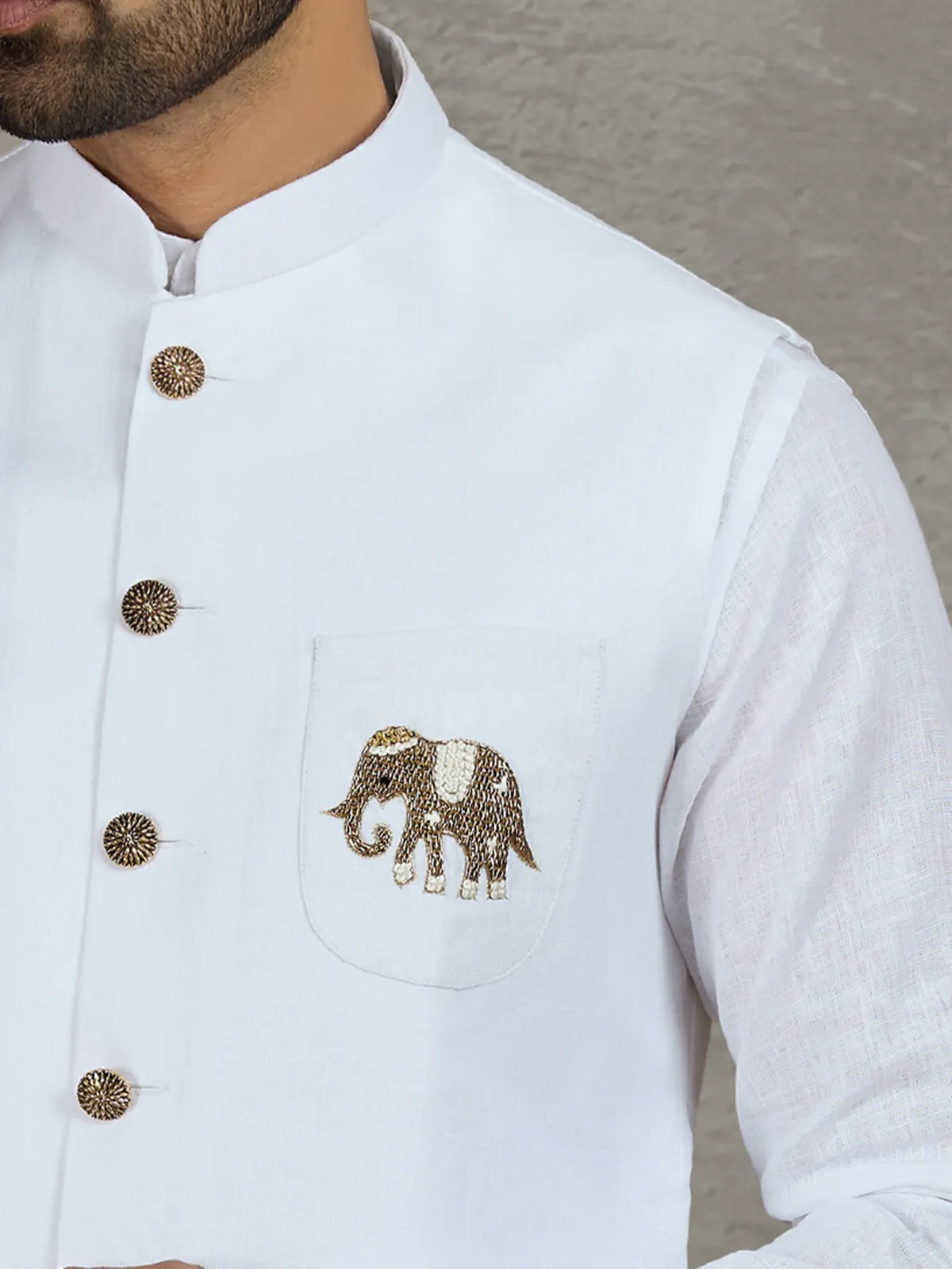 White linen waistcoat set with intricate zardosi work