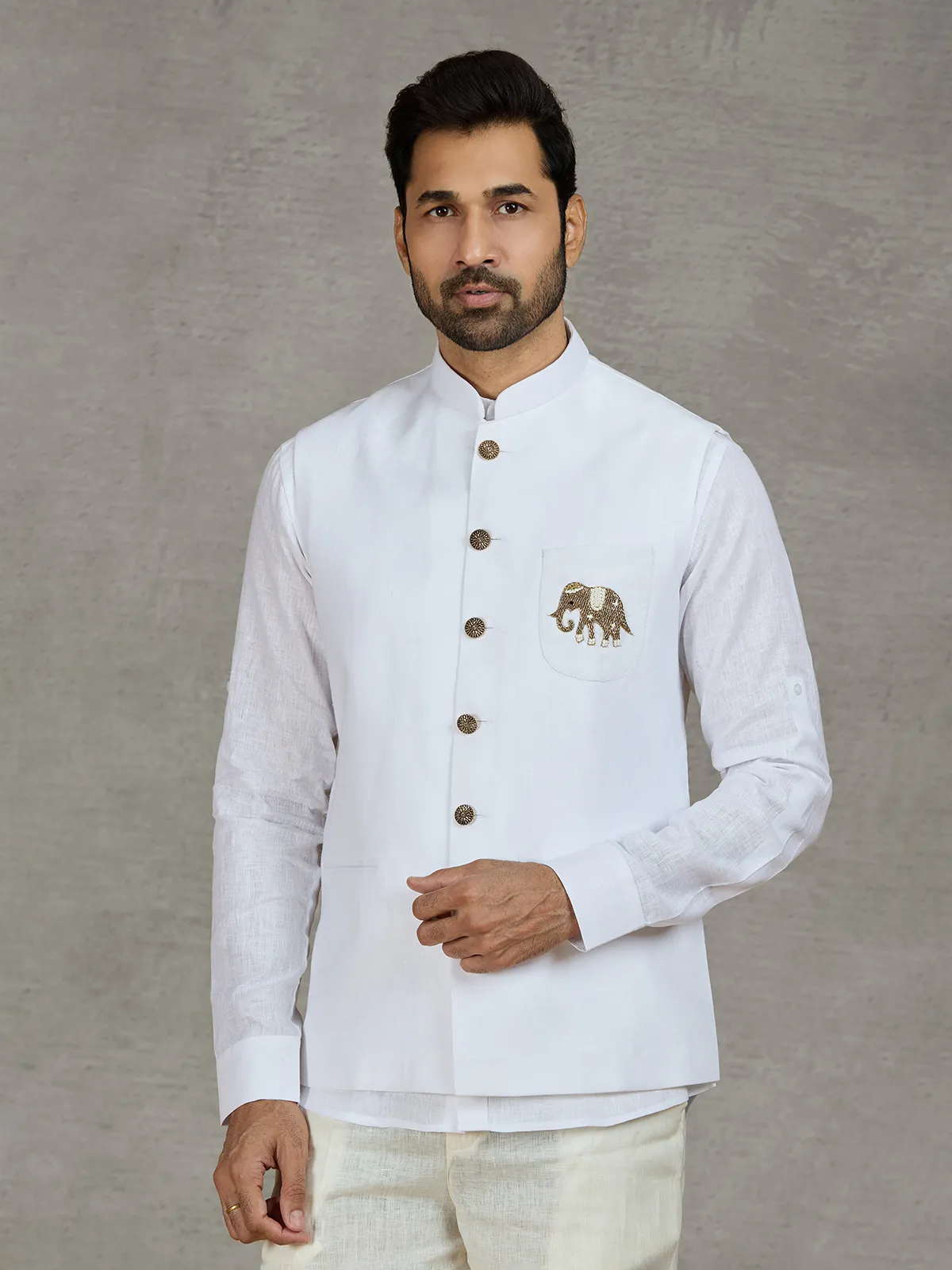 White linen waistcoat set with intricate zardosi work