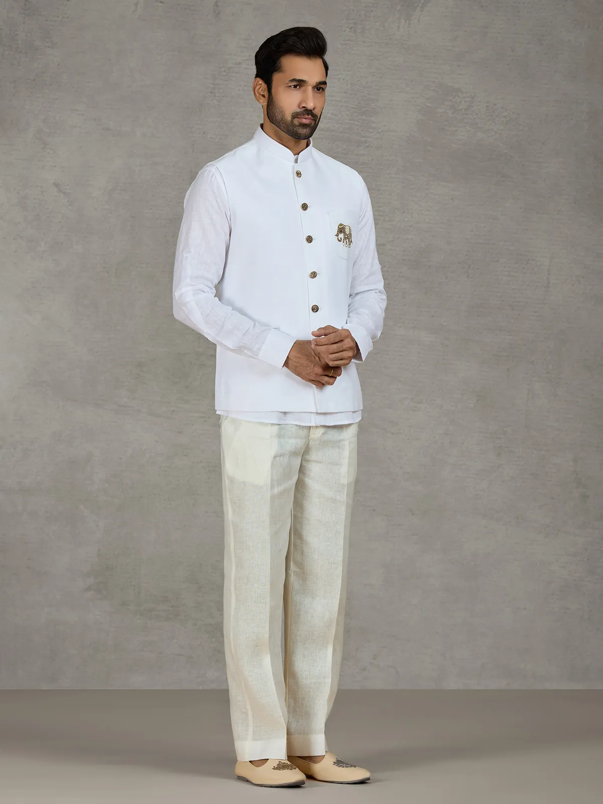White linen waistcoat set with intricate zardosi work