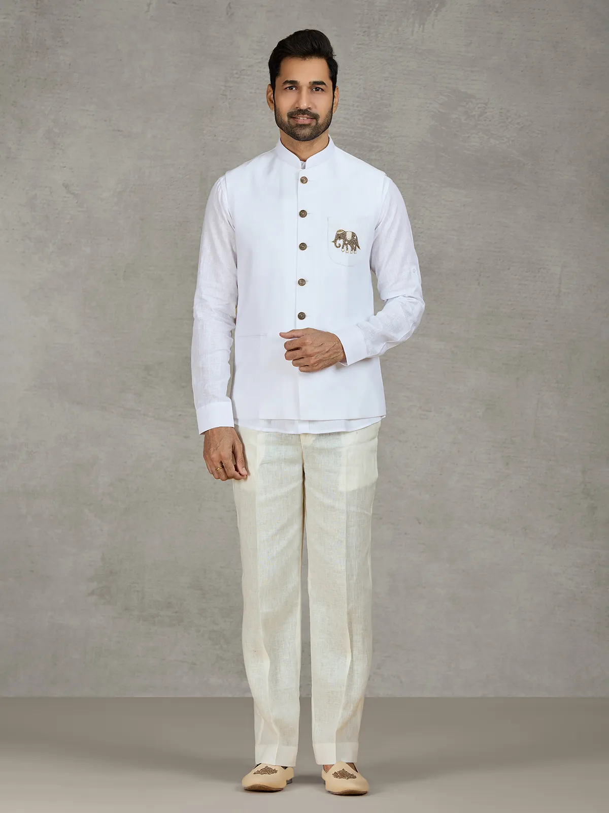 White linen waistcoat set with intricate zardosi work