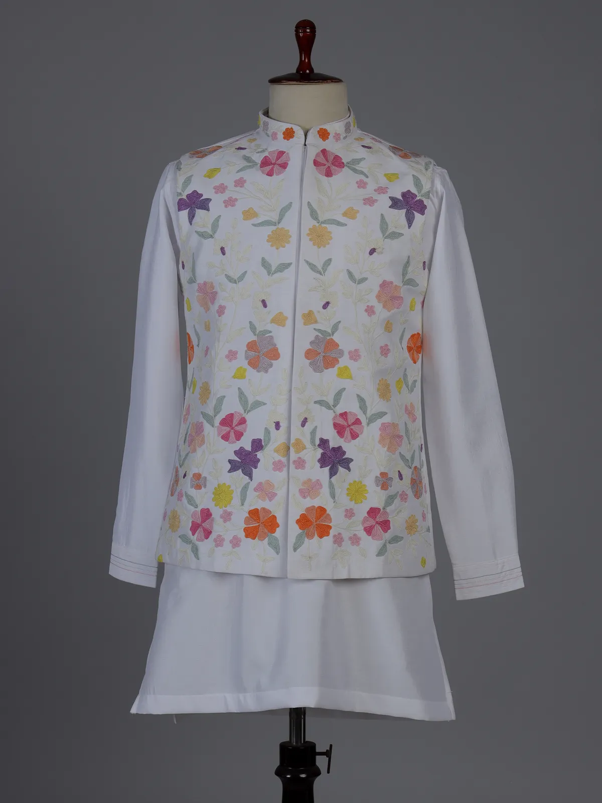 White silk waistcoat set with colorful floral thread