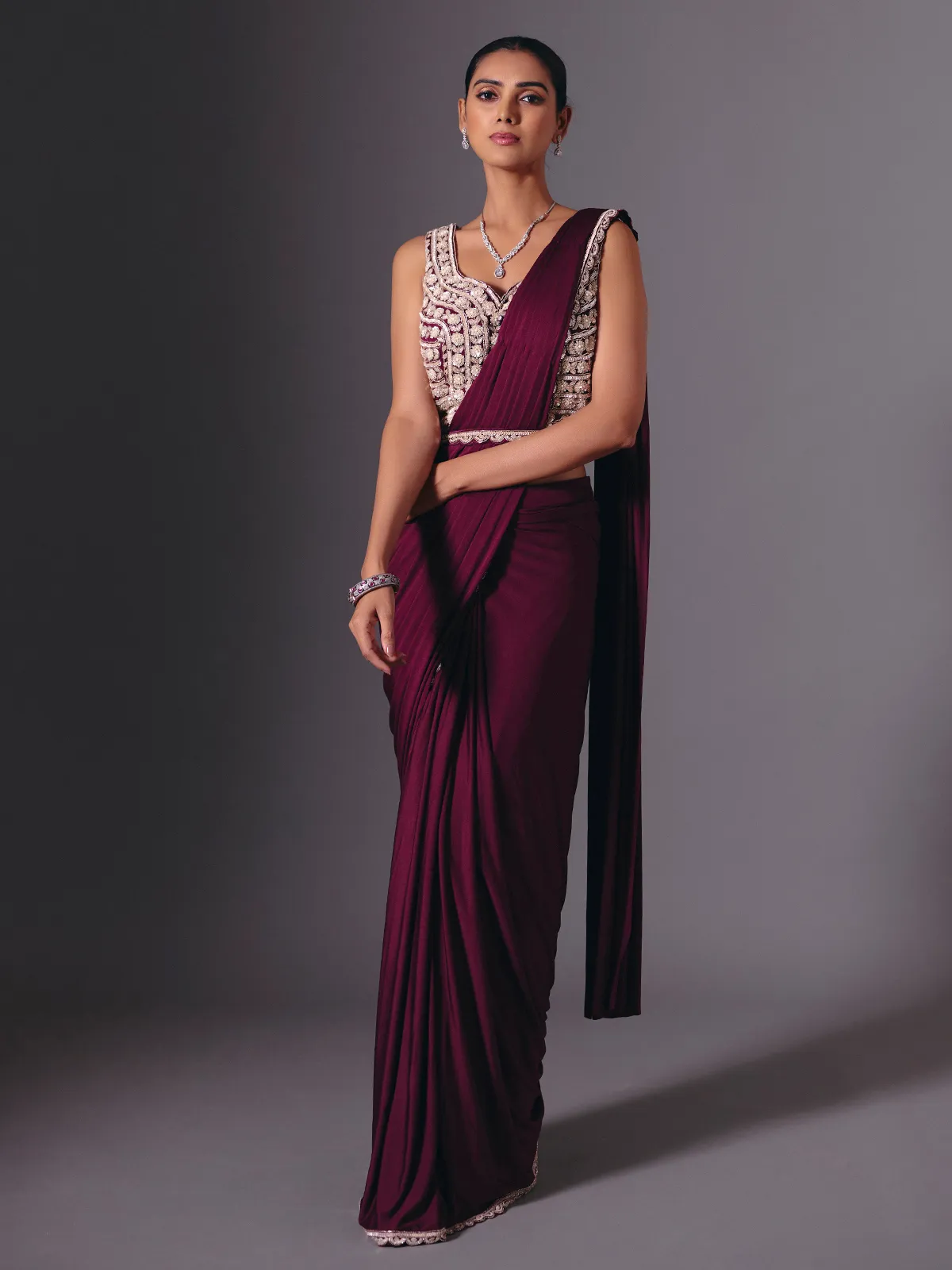 Wine lycra saree with sparkling cutdana and pearl work