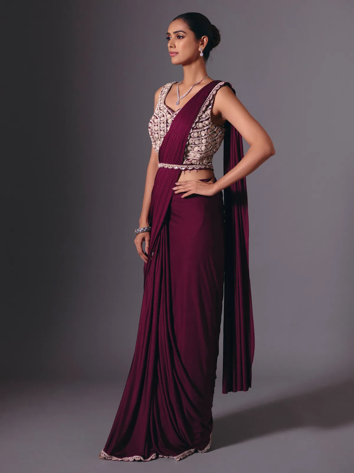 Wine lycra saree with sparkling cutdana and pearl work