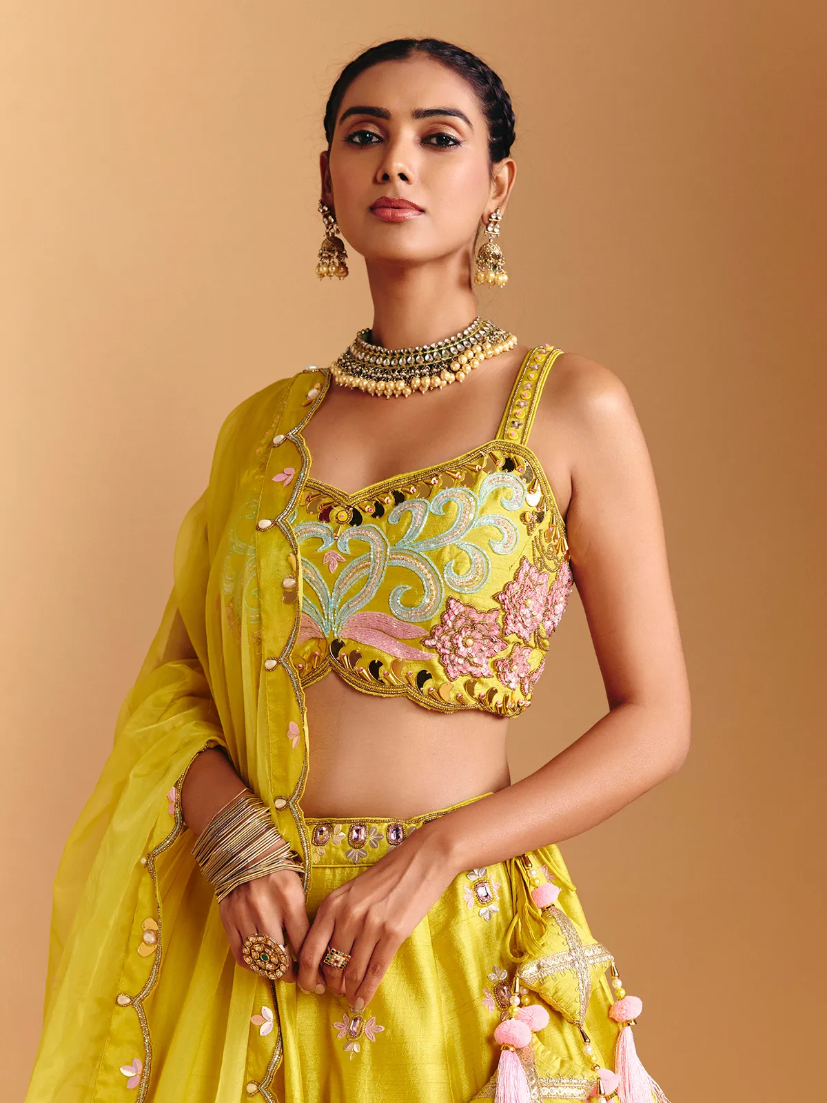 Yellow raw silk lehenga choli with mirror embellishments