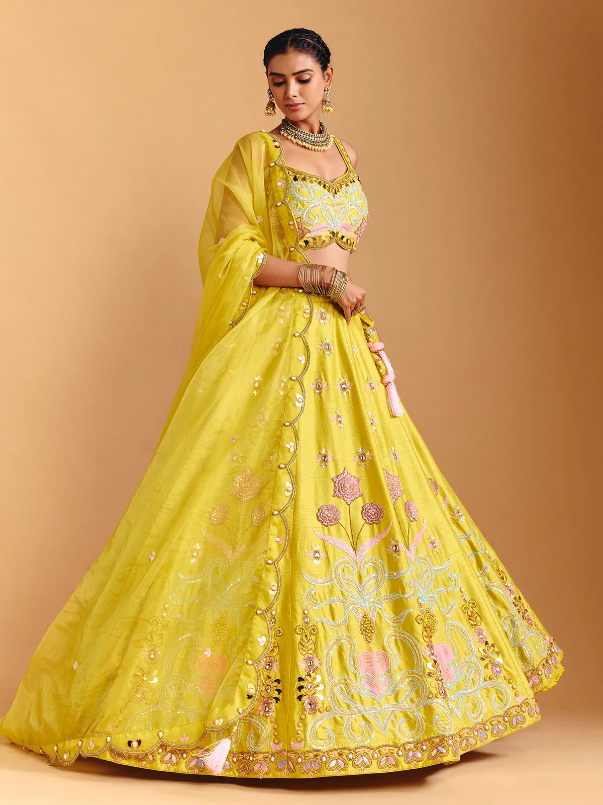 Yellow raw silk lehenga choli with mirror embellishments