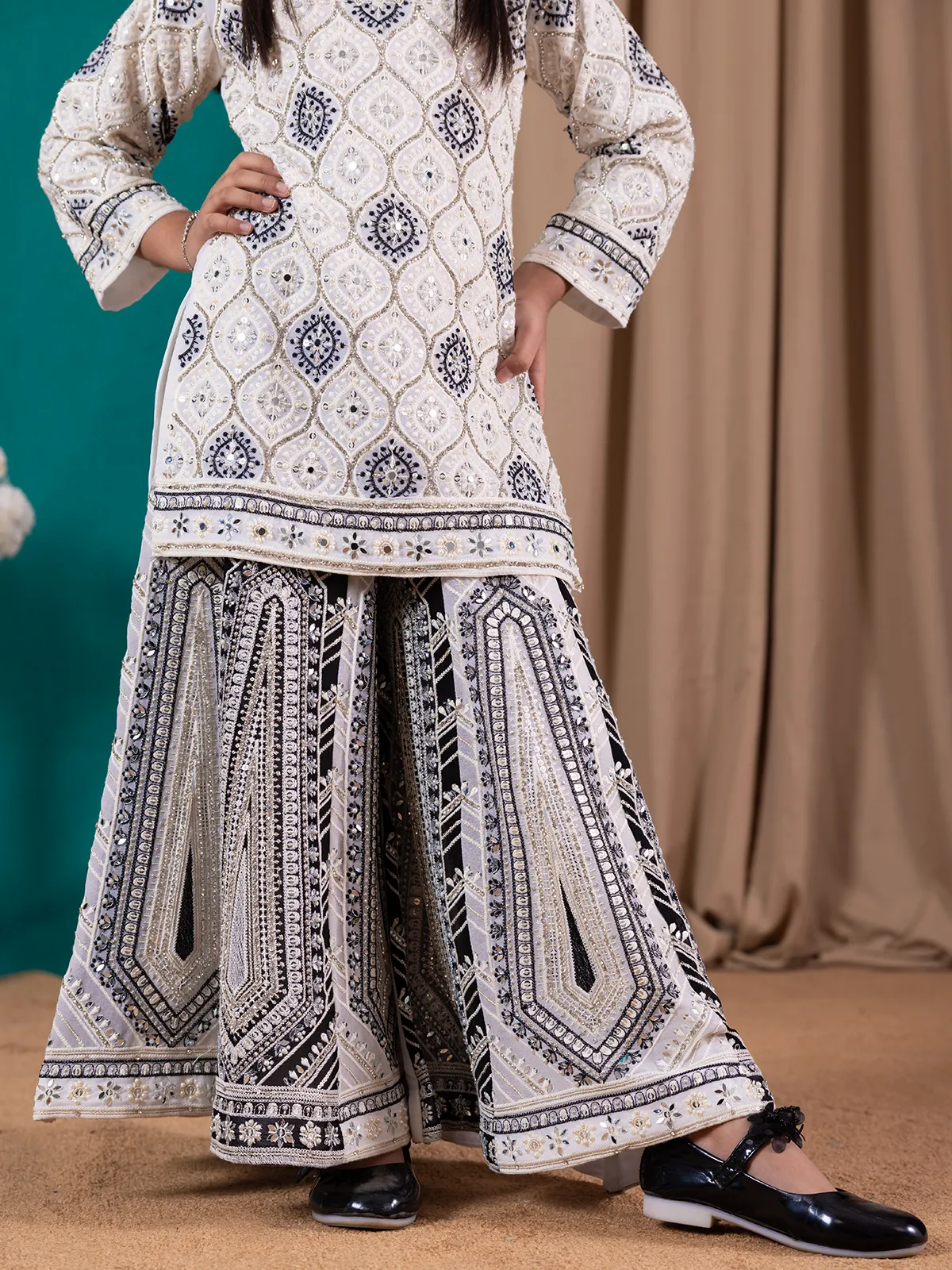 Fascinating cream and black palazzo salwar suit