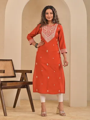 orange dress kurti This orange kurti features a beautiful blue section that adds a subtle contrast, ideal for both office settings and temple visits. Designed for comfort and style, it offers a blend of professionalism
