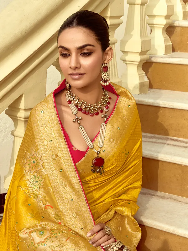 Yellow silk saree with zari work for reception wear