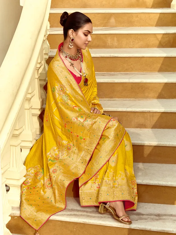 Yellow silk saree with zari work for reception wear