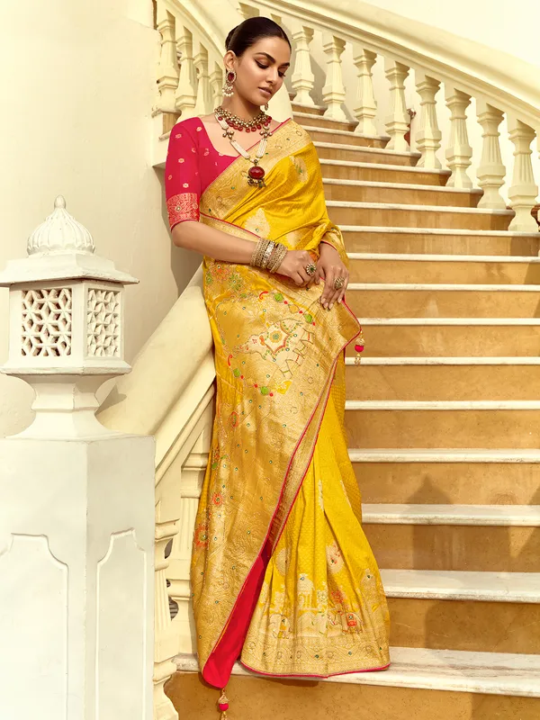 Yellow silk saree with zari work for reception wear