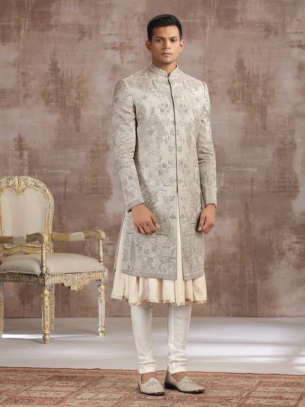 Antique gold tissue silk peshwai sherwani with royal detailing