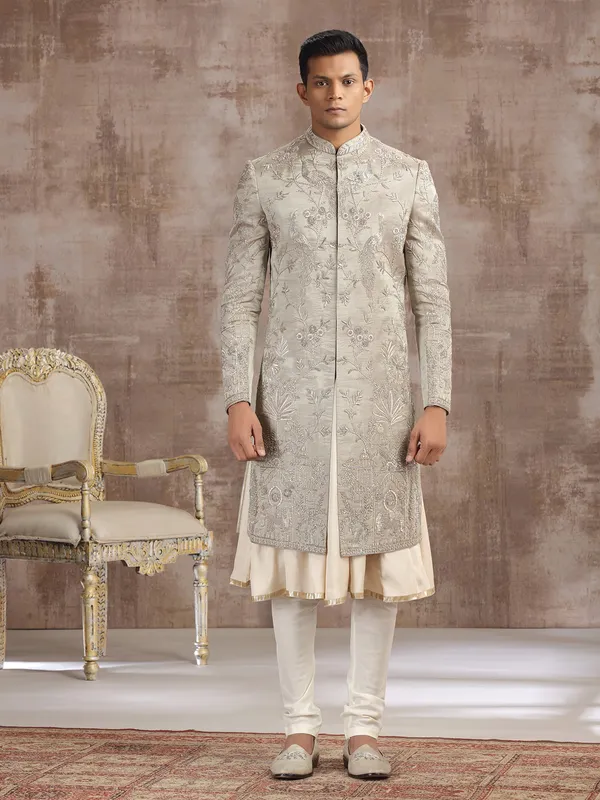 Antique gold tissue silk peshwai sherwani with royal detailing