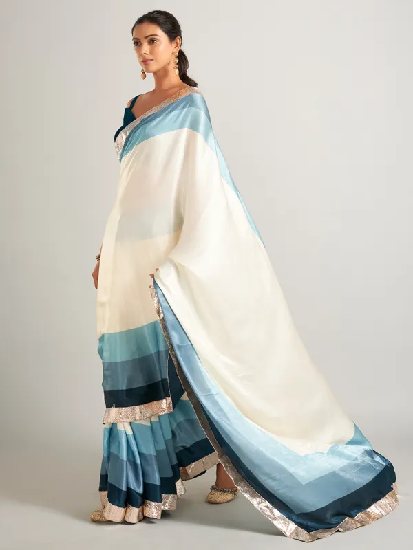 Appealing cream and blue masru silk saree