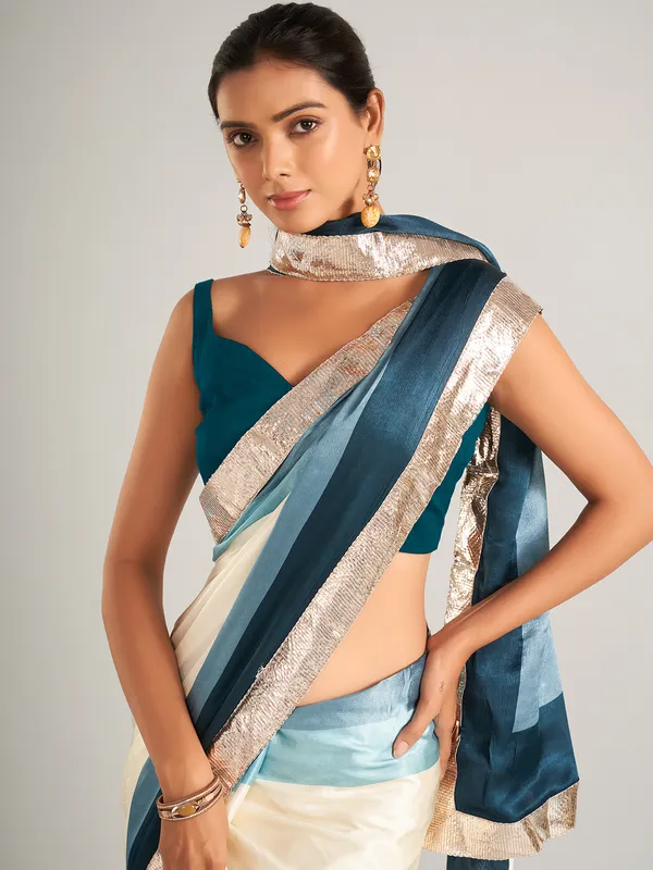 Appealing cream and blue masru silk saree