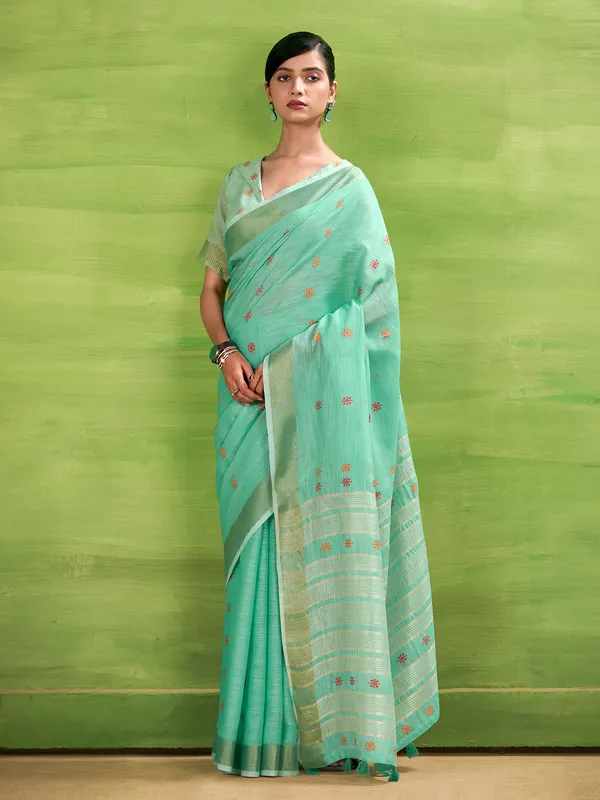 Aqua blue linen silk printed zari saree