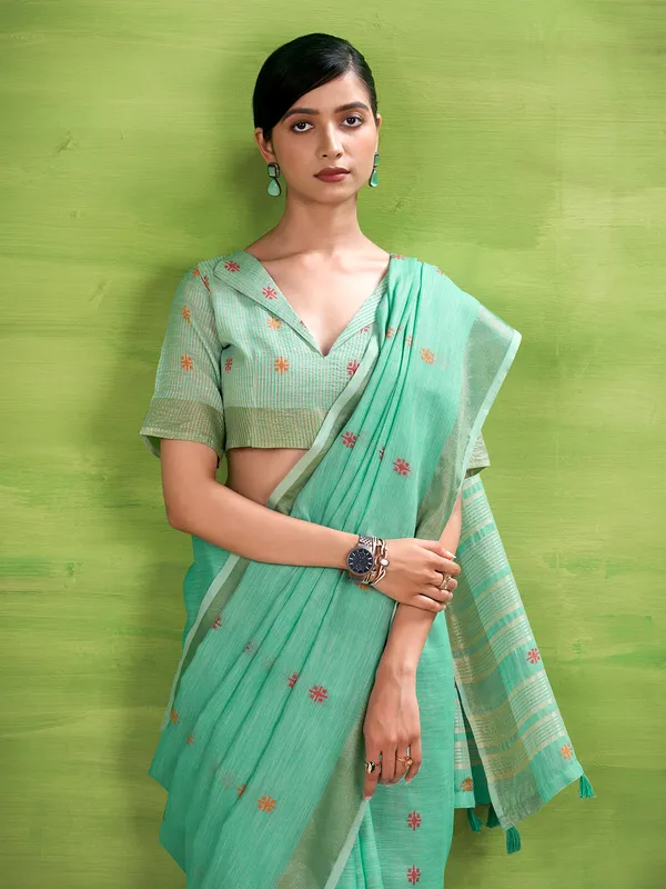 Aqua blue linen silk printed zari saree