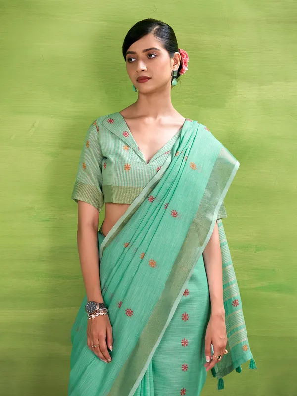 Aqua blue linen silk printed zari saree