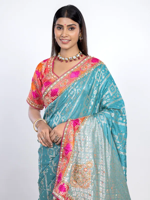 Aqua dola silk saree with orange blouse