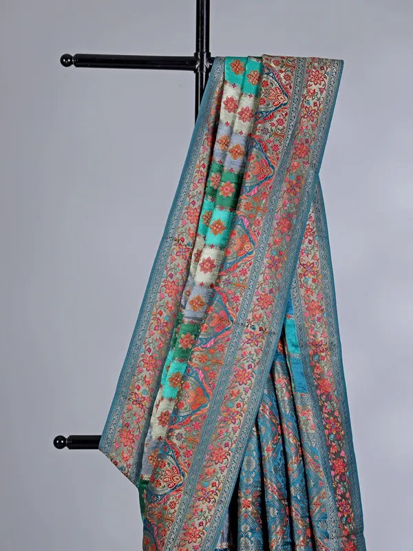 Aqua green printed mashru silk saree with zari detailing