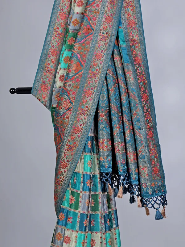 Aqua green printed mashru silk saree with zari detailing