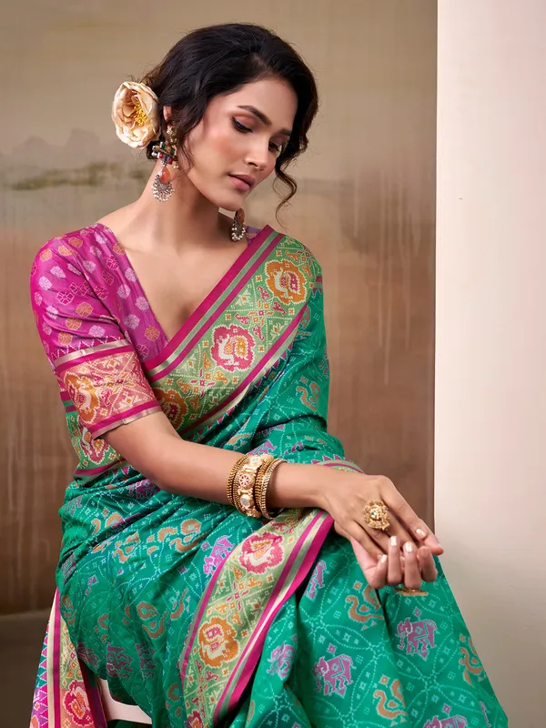 Aqua patola silk saree with pink blouse