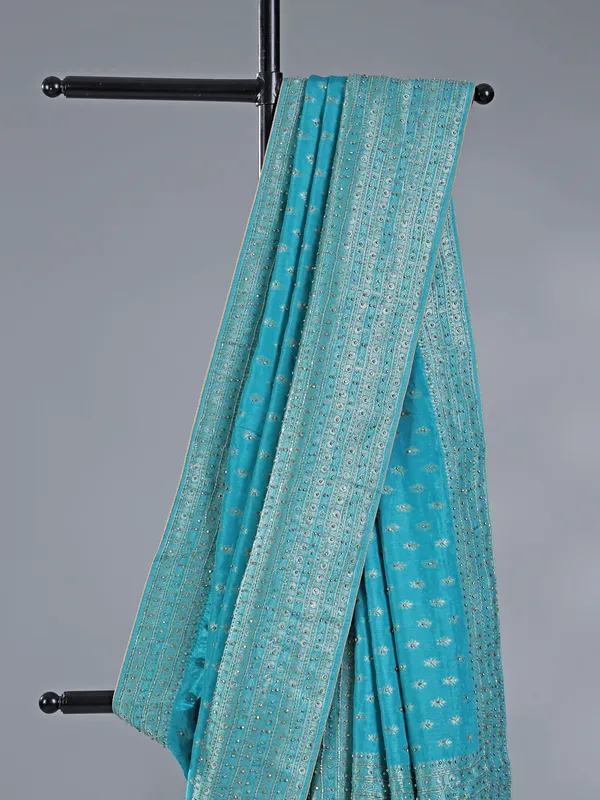 Aqua silk saree with subtle zari highlights