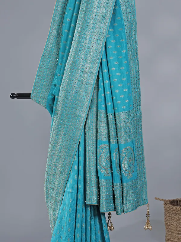 Aqua silk saree with subtle zari highlights