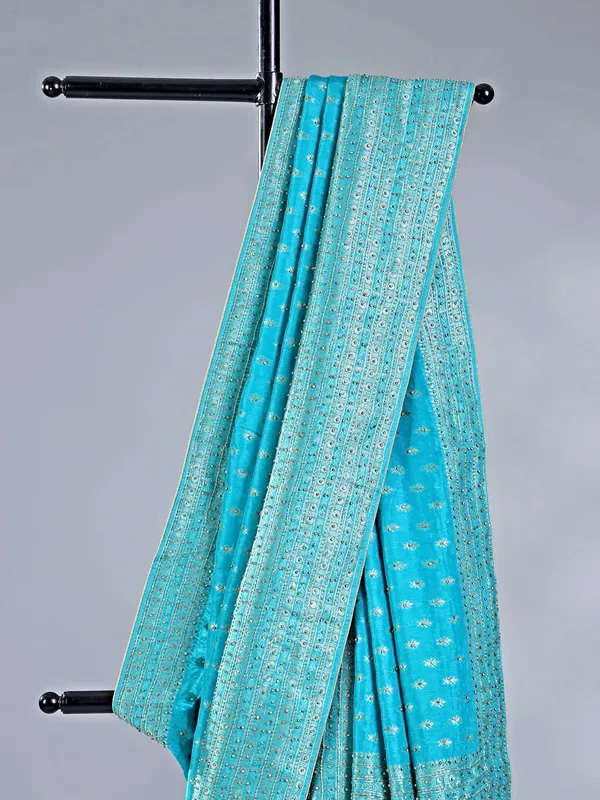Aqua silk saree with subtle zari highlights