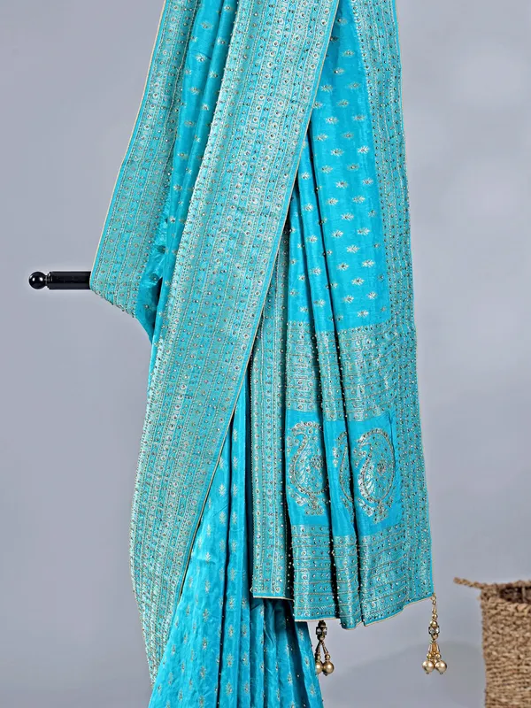 Aqua silk saree with subtle zari highlights