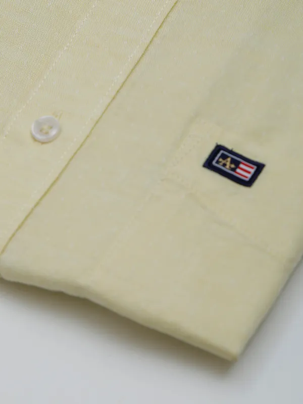 Arrow plain cotton light yellow shirt for formal wear