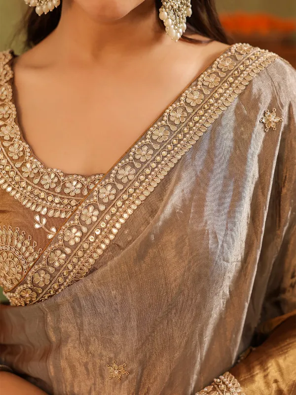 Beige brown tissue silk saree with rich embroidery