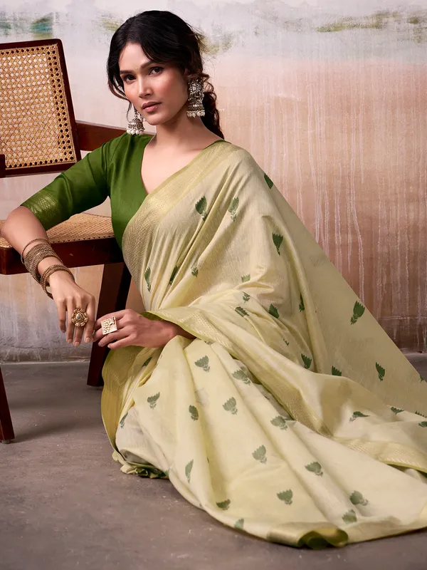 Beige cotton saree with green motifs
