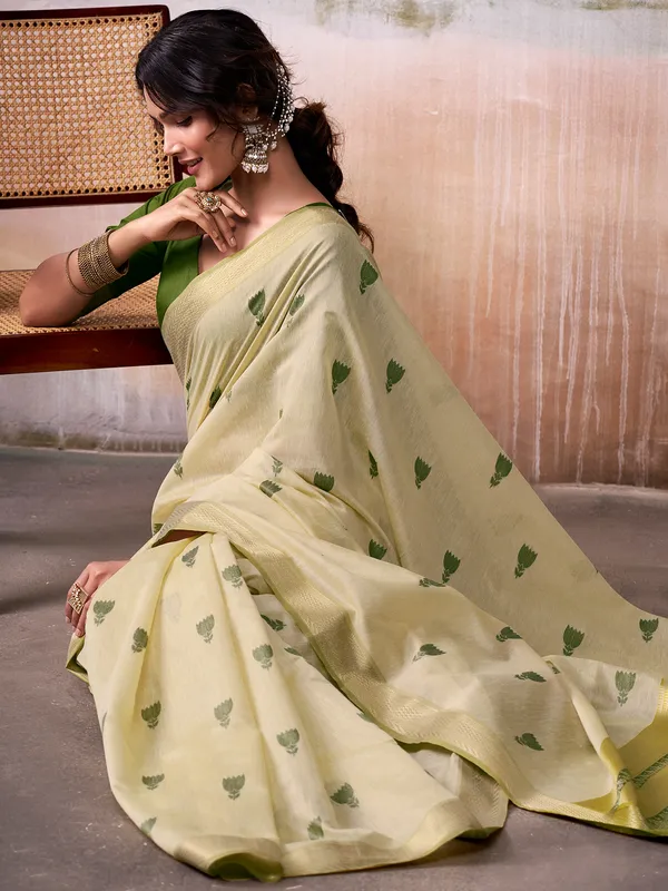 Beige cotton saree with green motifs