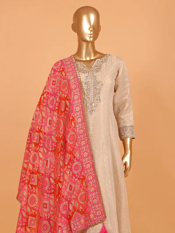 Beige cotton silk salwar suit with red dupatta