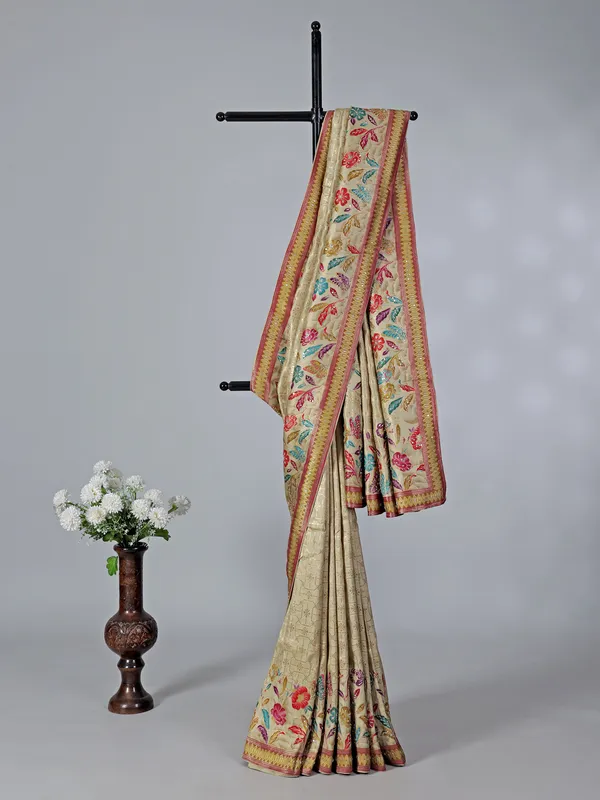 Beige dola silk saree with florals colorful motifs