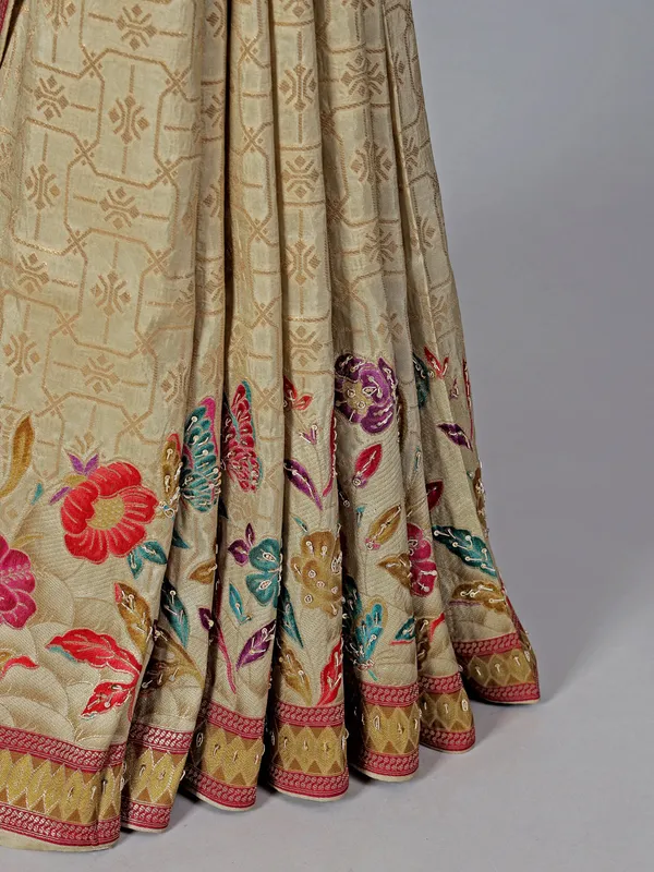 Beige dola silk saree with florals colorful motifs