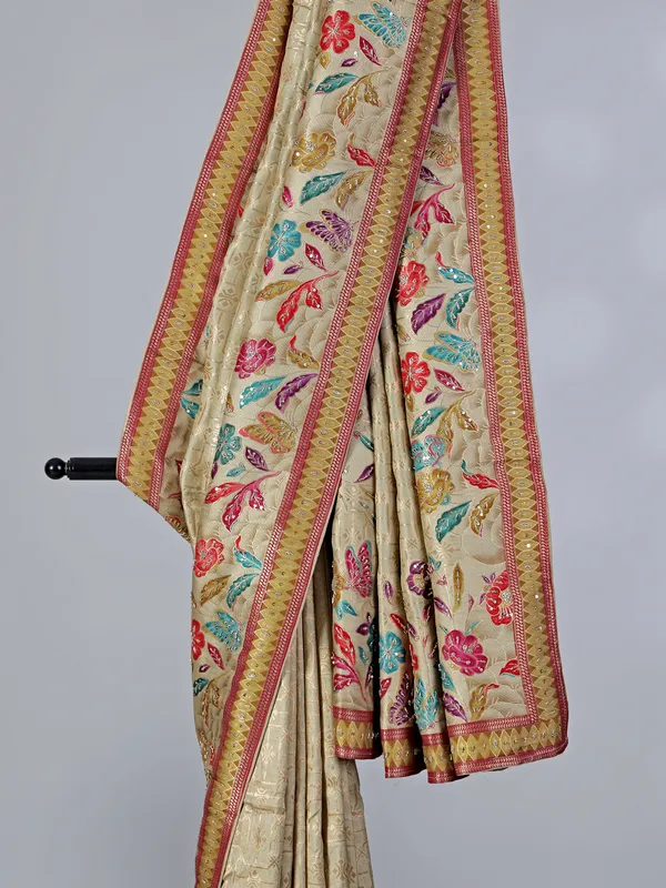 Beige dola silk saree with florals colorful motifs