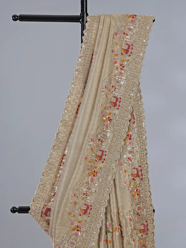 Beige dola silk saree with zari work