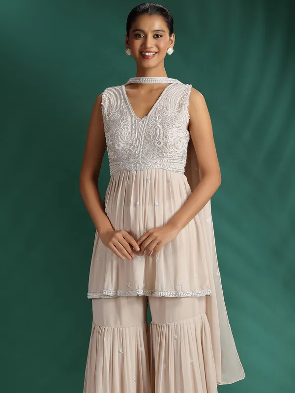 Beige embellished sharara suit with dupatta