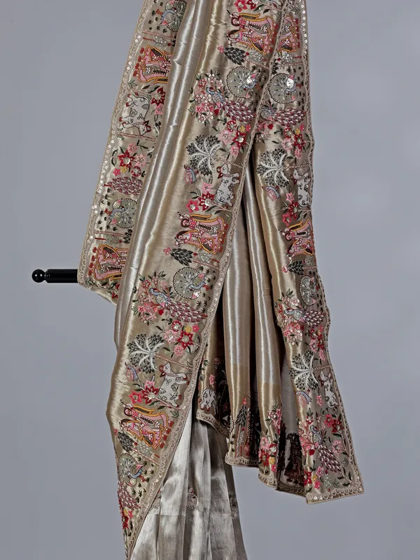 Beige embroidered tissue silk saree
