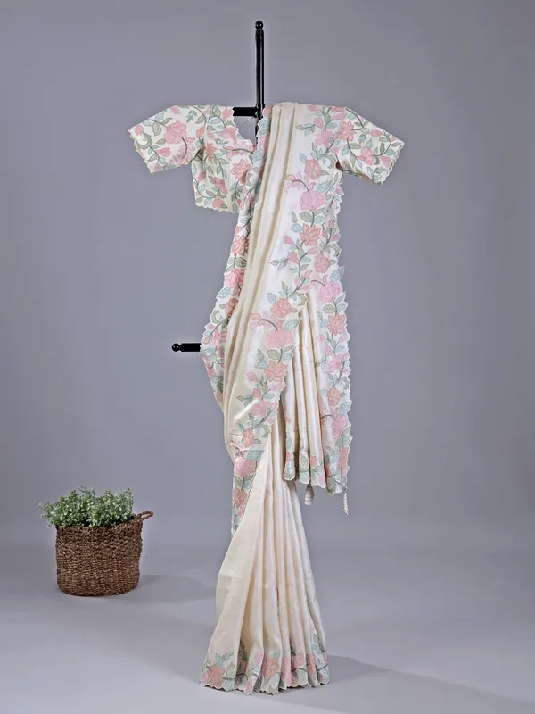 Beige festive wear saree with embroidered border