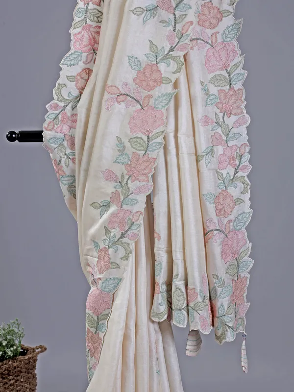 Beige festive wear saree with embroidered border