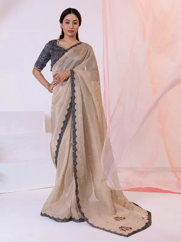 Beige festive wear tissue silk saree