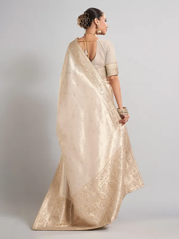 Beige kanjivaram silk saree for traditional wedding elegance