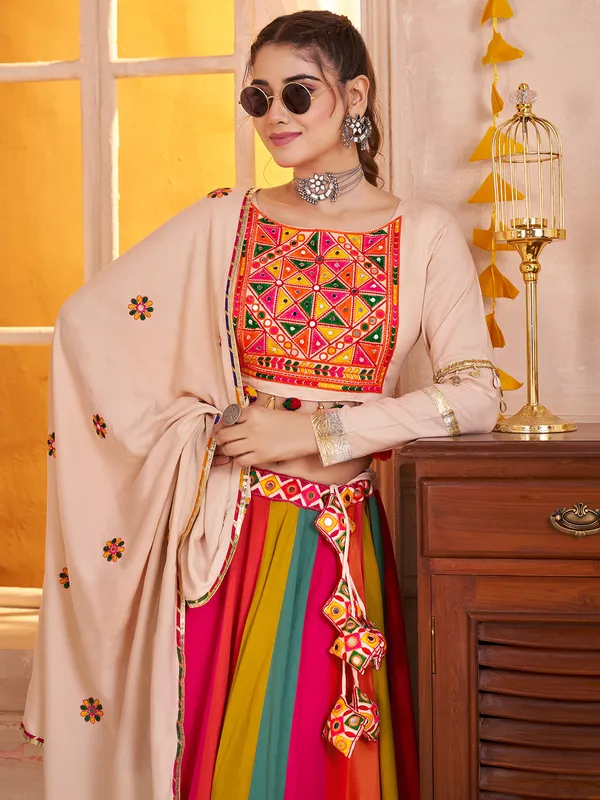 Beige navratri chaniya choli with embroidery and cowrie shell