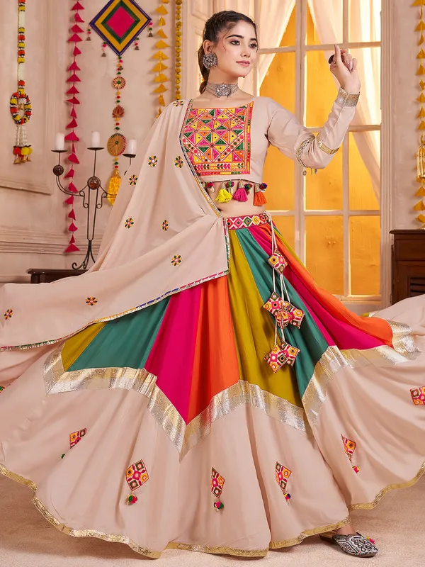 Beige navratri chaniya choli with embroidery and cowrie shell