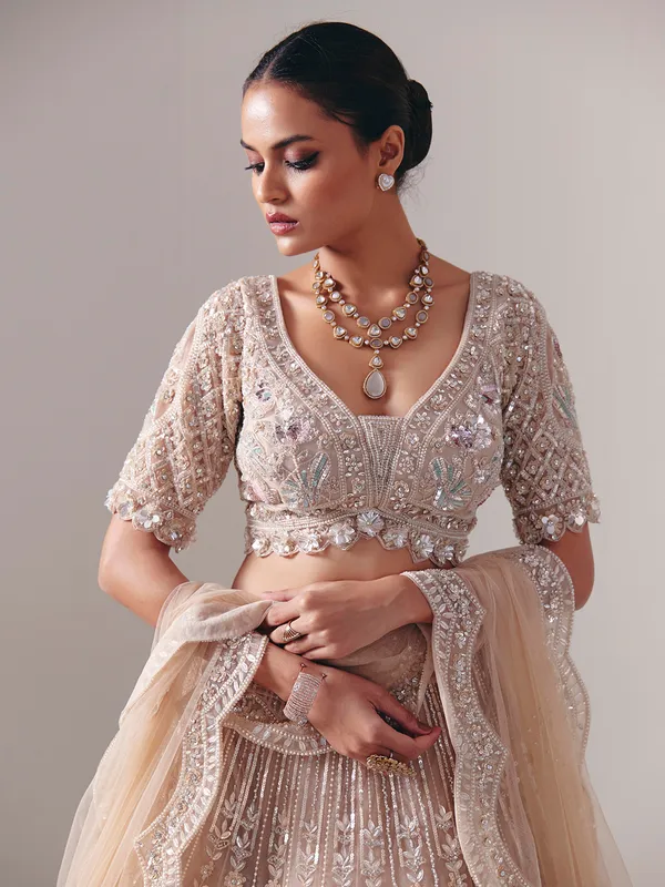 Beige net diamond and pearl bridal lehenga choli